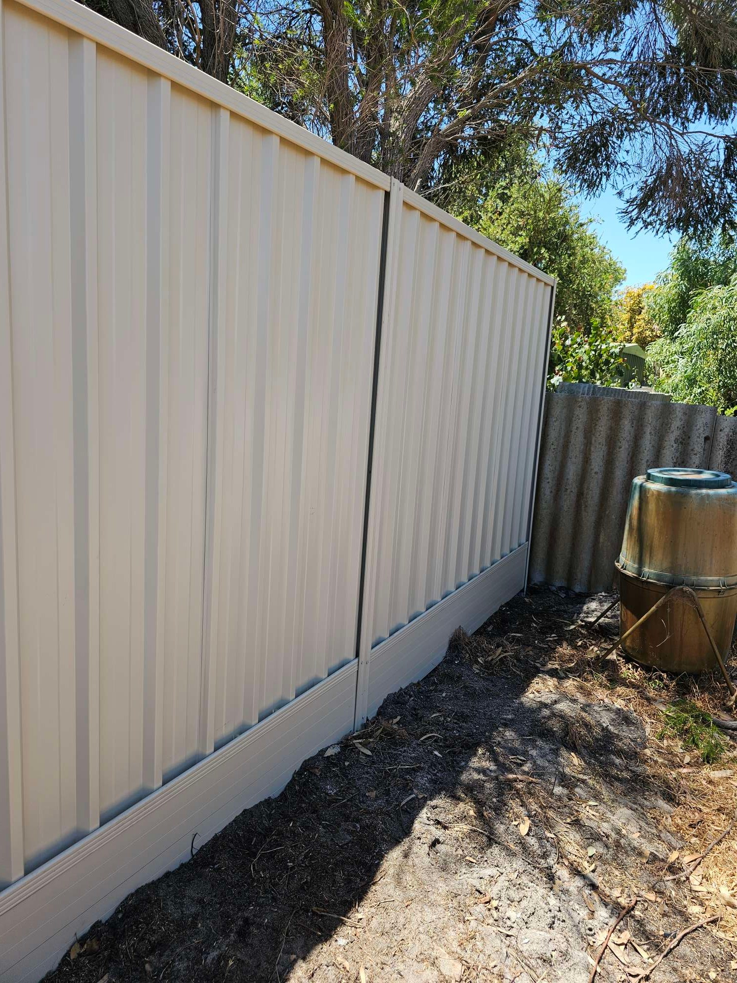 New Colorbond fence replacing a storm-damaged boundary fence