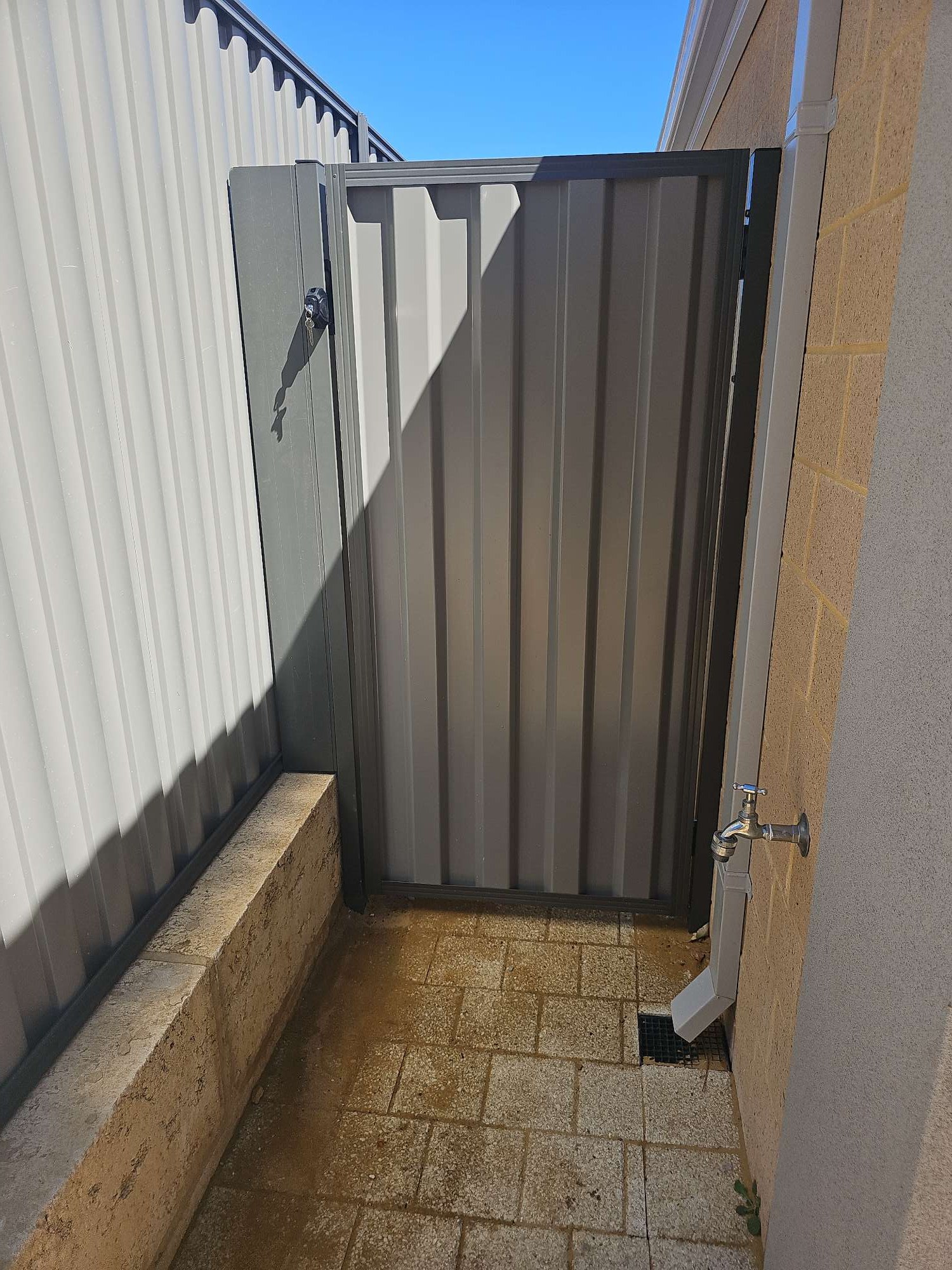 Cream Colorbond fence corner detail