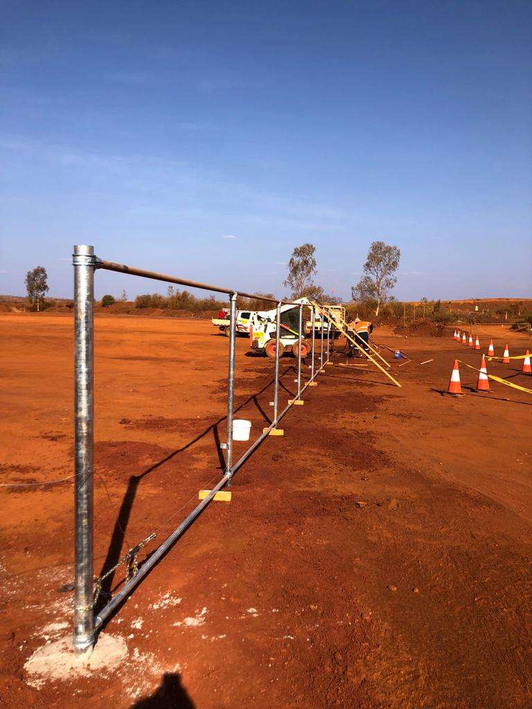 Chain link fence framework being installed on a remote WA site